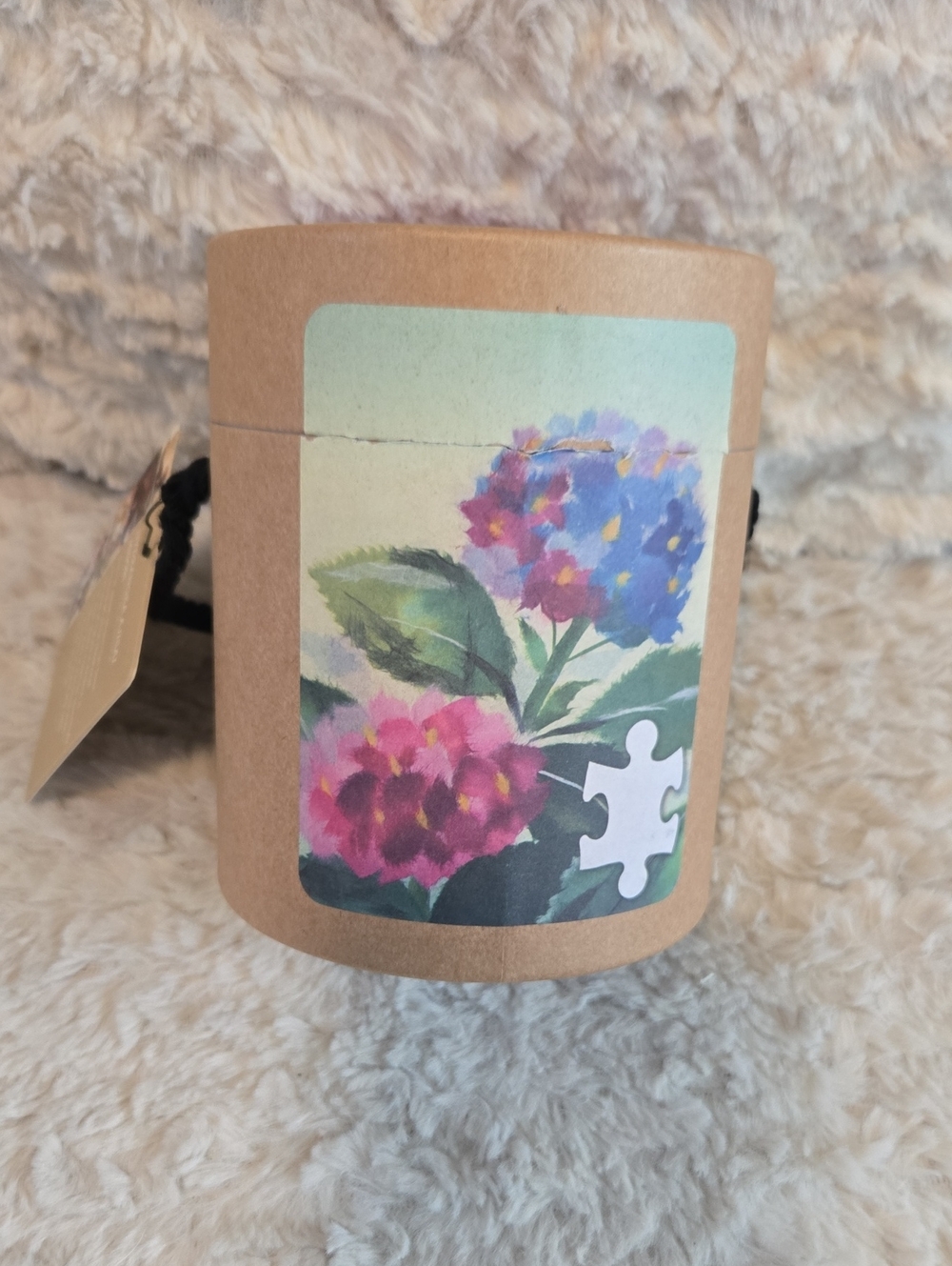 Demdaco Kraft Cylinder Puzzle Box with Teal Label and Black Rope